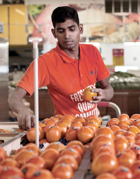 Carrefour Employee Picking Fruits