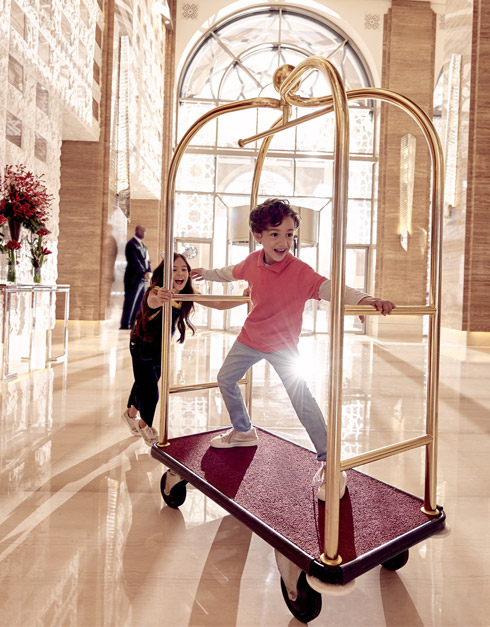 Boy Playing in the Hotel Lobby