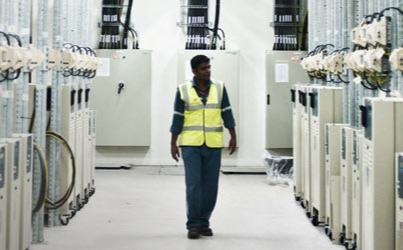 Worker Walking in Hallway